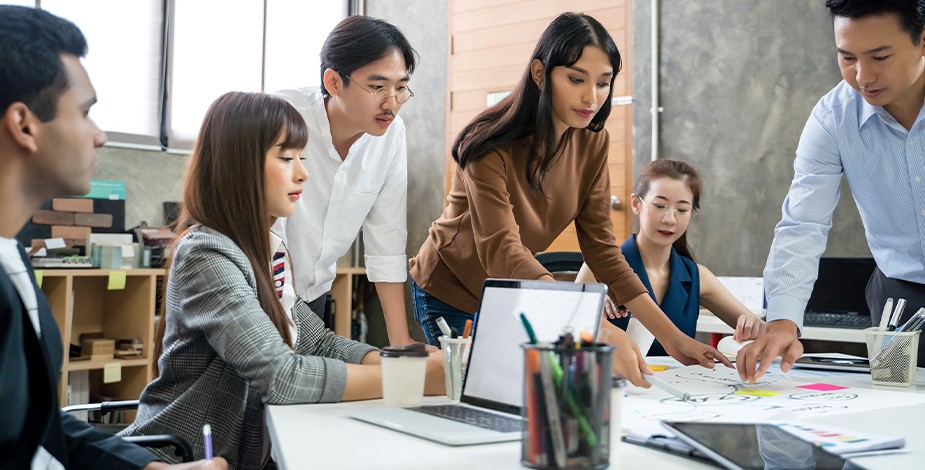 A group of professionals collaborating in an office environment